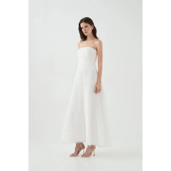 Aje Aus Dresses – structured silhouette with raw femininity from Coveti