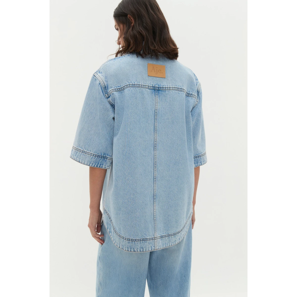 Aje clothing Aus Shorts – structured silhouette with raw femininity from Coveti