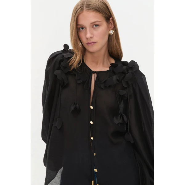 Aje clothing Aus Tops – structured silhouette with raw femininity from Coveti