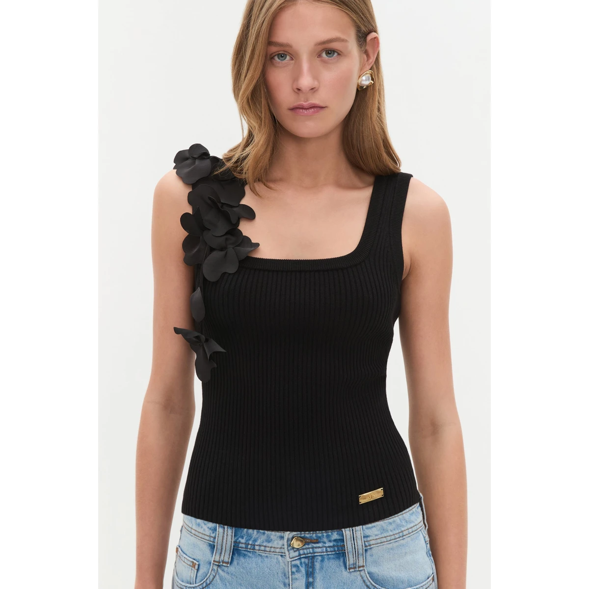 Aje Aus Tops – structured silhouette with raw femininity from Coveti