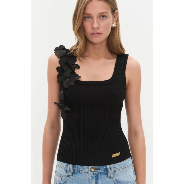 Aje Aus Tops – structured silhouette with raw femininity from Coveti