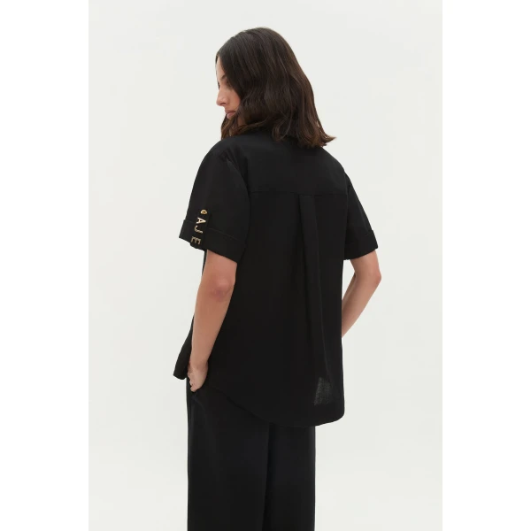 Aje Aus Tops – structured silhouette with raw femininity from Coveti