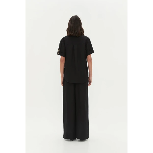 Aje clothing Aus Tops – structured silhouette with raw femininity from Coveti