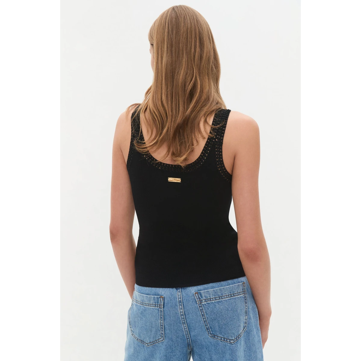 Aje Aus Tops – structured silhouette with raw femininity from Coveti