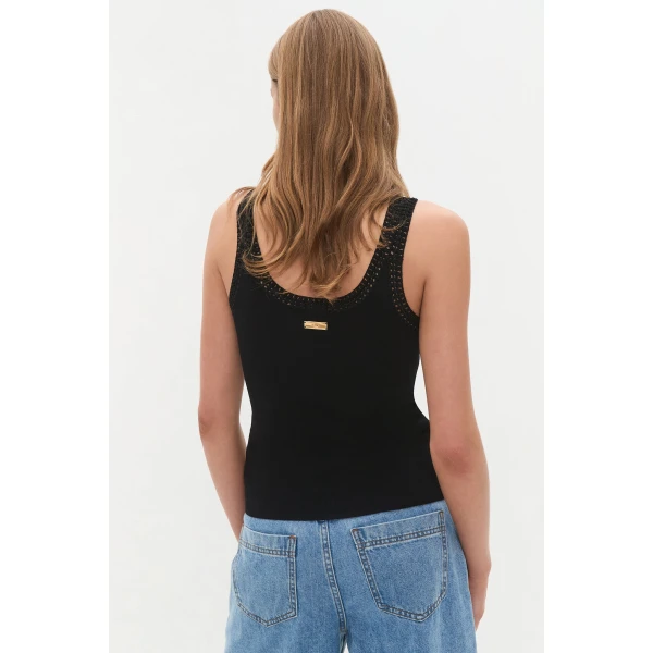 Aje Aus Tops – structured silhouette with raw femininity from Coveti