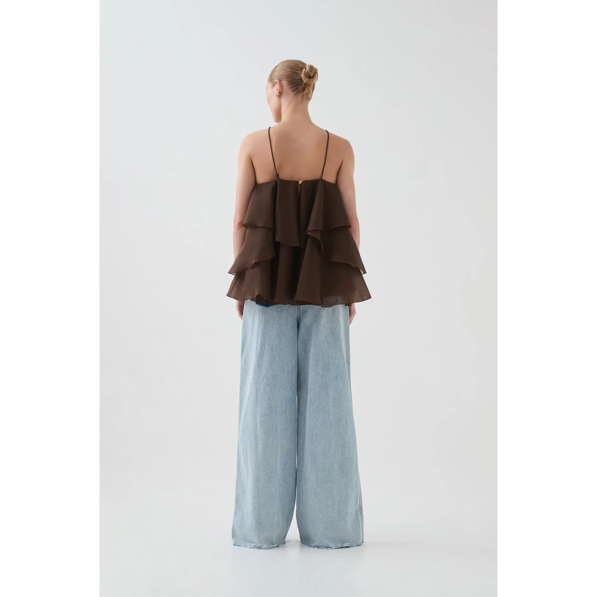 Aje Aus Tops – structured silhouette with raw femininity from Coveti