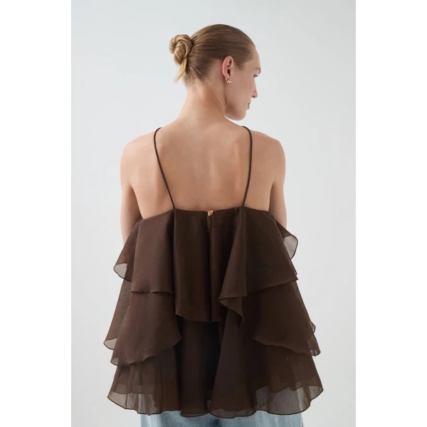 Aje clothing Aus Tops – structured silhouette with raw femininity from Coveti