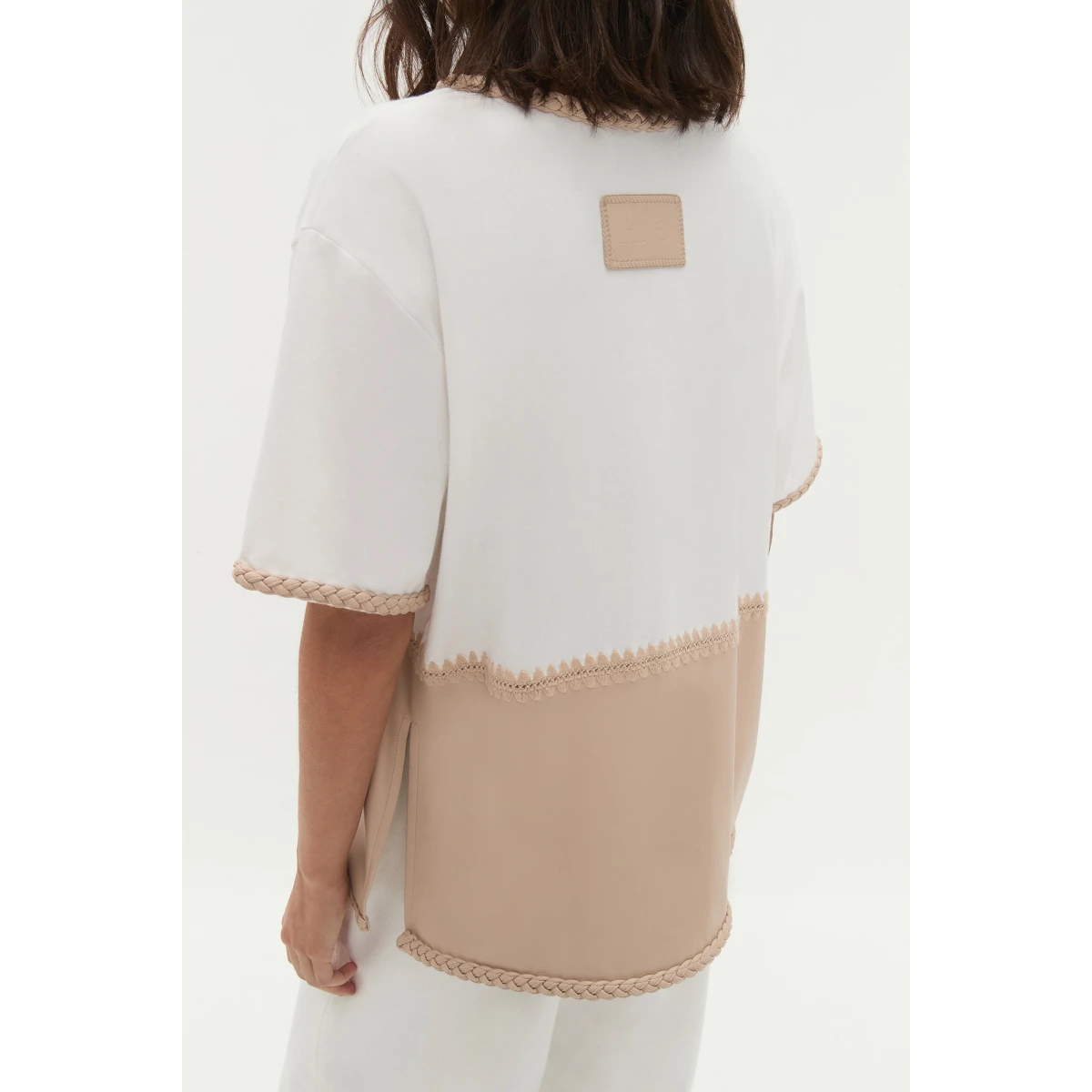 Aje Aus Tops – structured silhouette with raw femininity from Coveti
