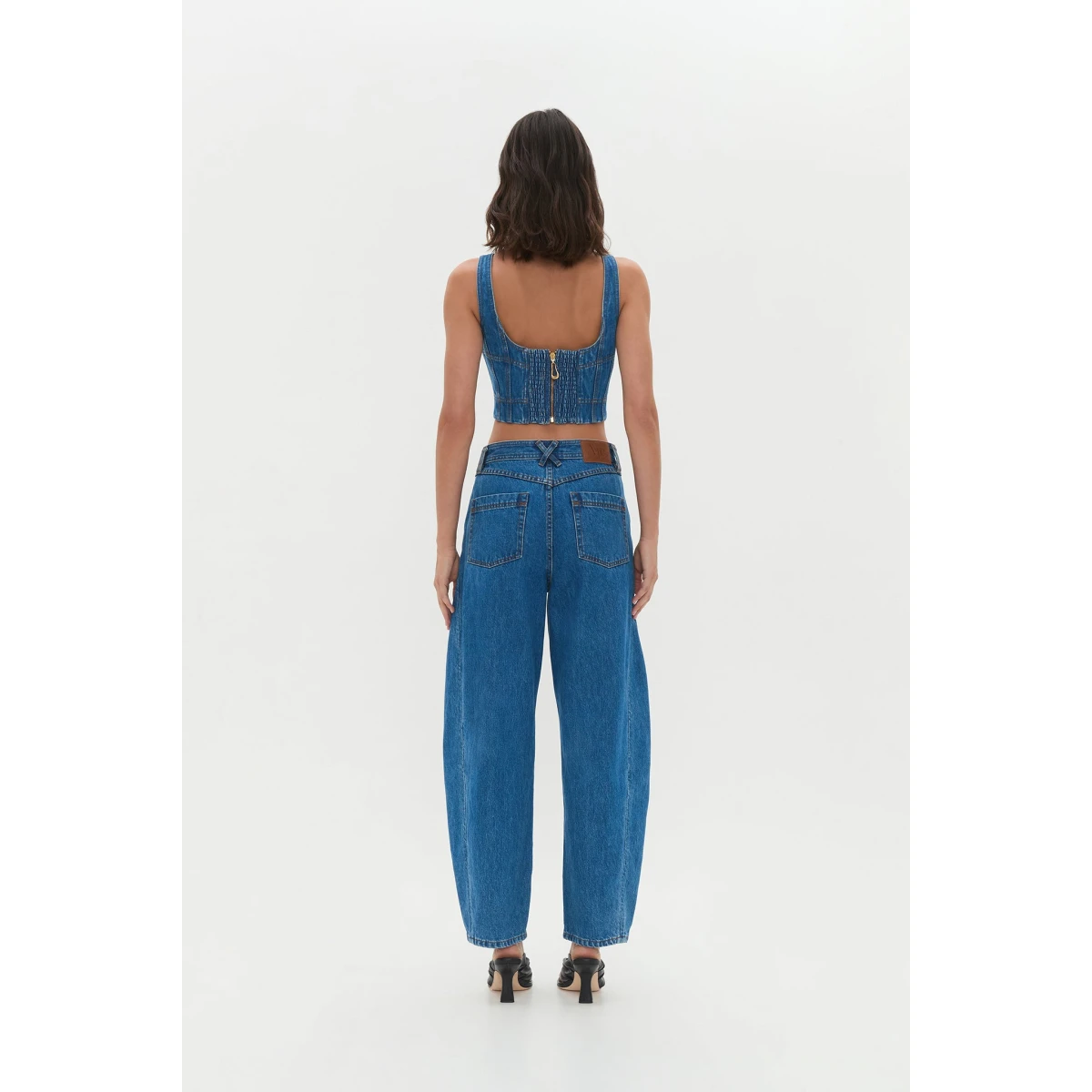 Aje Aus Tops – structured silhouette with raw femininity from Coveti