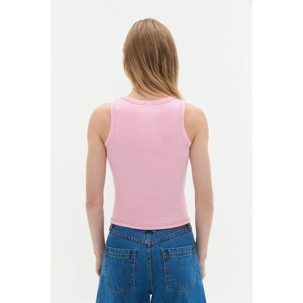 Aje Aus Tops – structured silhouette with raw femininity from Coveti