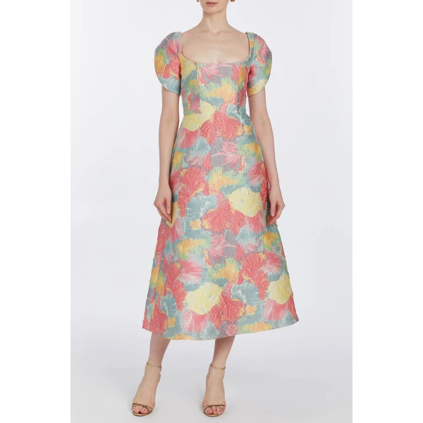 Markarian dresses with romantic neckline and structured silhouette