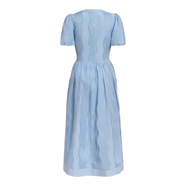Markarian dresses with romantic neckline and structured silhouette
