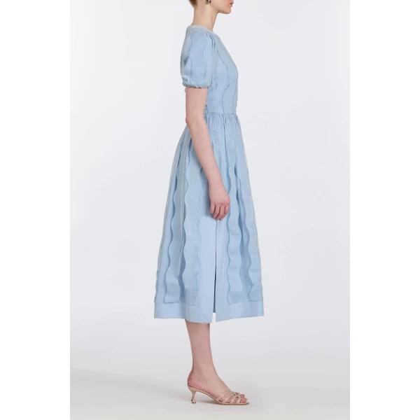 Markarian gowns with romantic neckline and structured silhouette