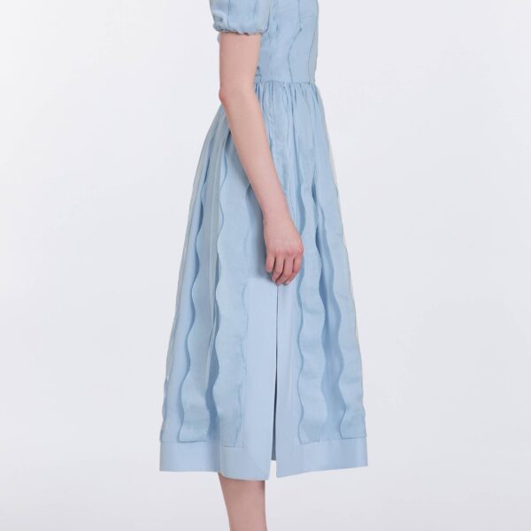 Markarian gowns with romantic neckline and structured silhouette