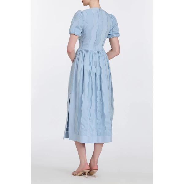 Markarian gowns with romantic neckline and structured silhouette