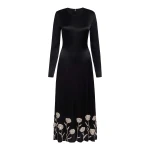 Markarian gown with romantic neckline and structured silhouette
