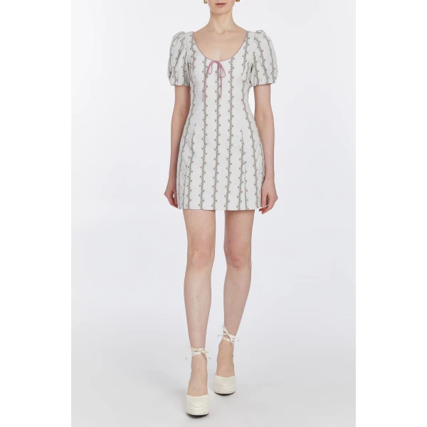 Markarian dresses with romantic neckline and structured silhouette