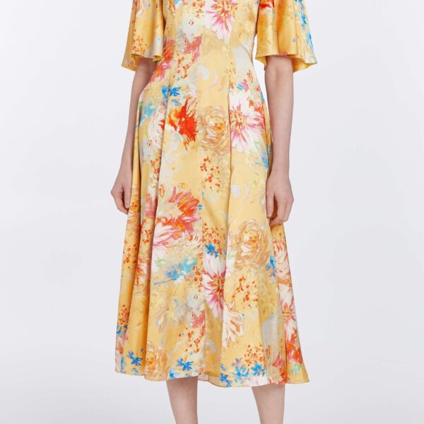 Markarian dresses with romantic neckline and structured silhouette