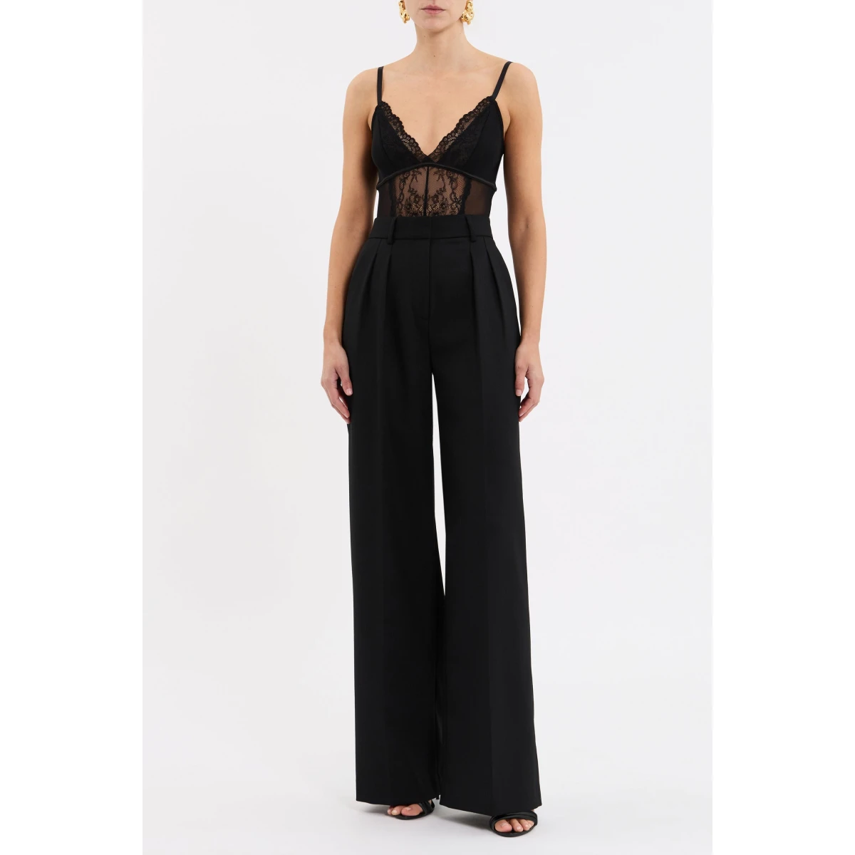 the fitted silhouette is enhanced with chic panel detailing that adds a touch of sophisticated allure. Adjustable spaghetti straps provide both support and comfort