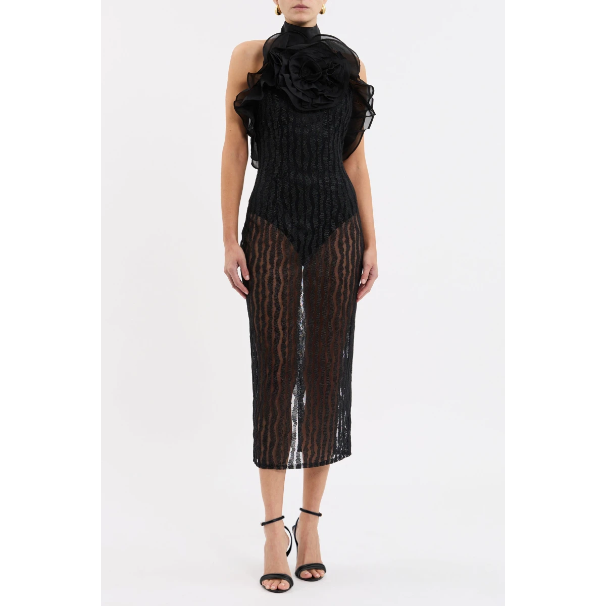 tailored from embroidered mesh. Featuring an alluring sheer silhouette