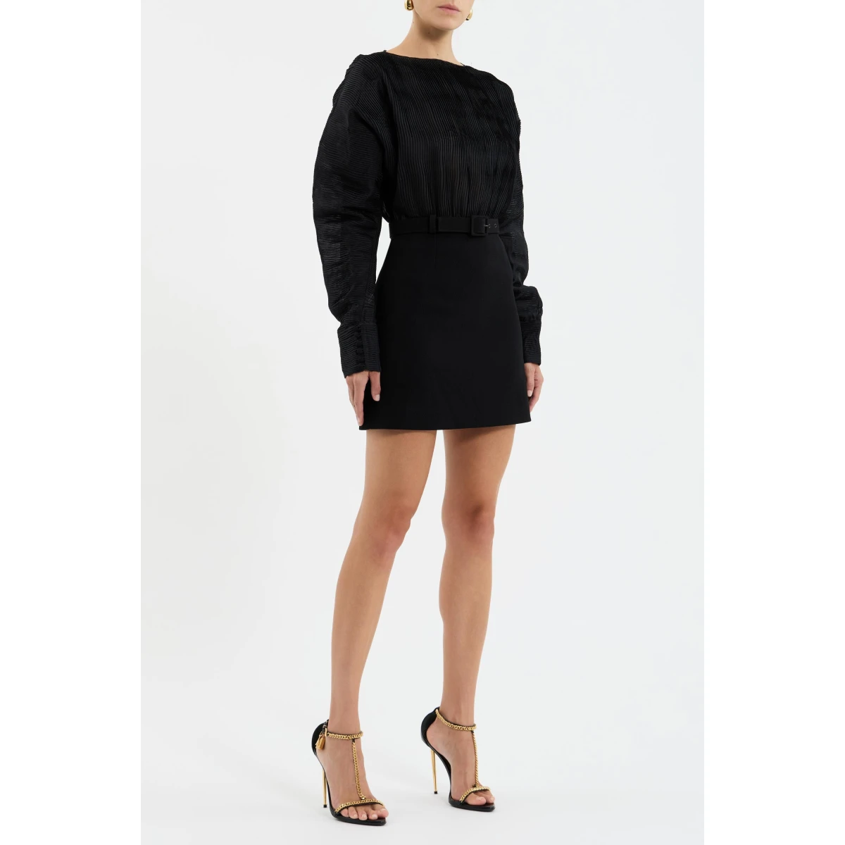 with a relaxed fit and cocoon long sleeves that shapes a timeless silhouette. Wide cuffs add a refined edge