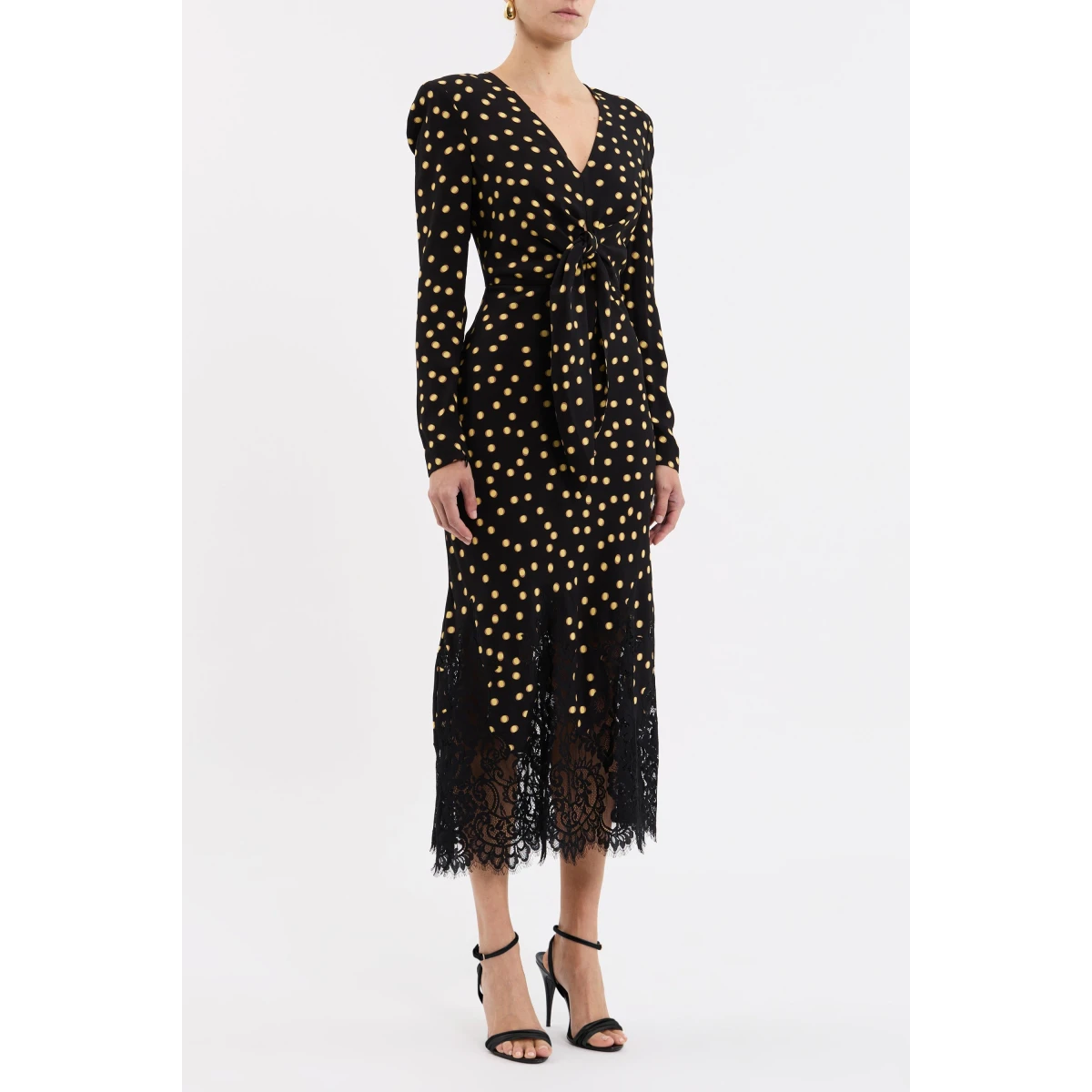 the bias cut silhouette is elevated with a front tie detail and scallop lace trim