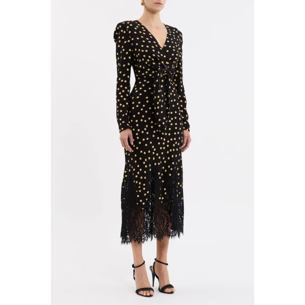 the bias cut silhouette is elevated with a front tie detail and scallop lace trim