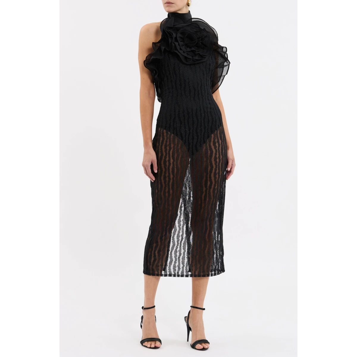 the built-in bodysuit with press snaps ensure utmost comfort and support. The sophisticated halter neckline is elevated with an organza flower and double layer frill detailing