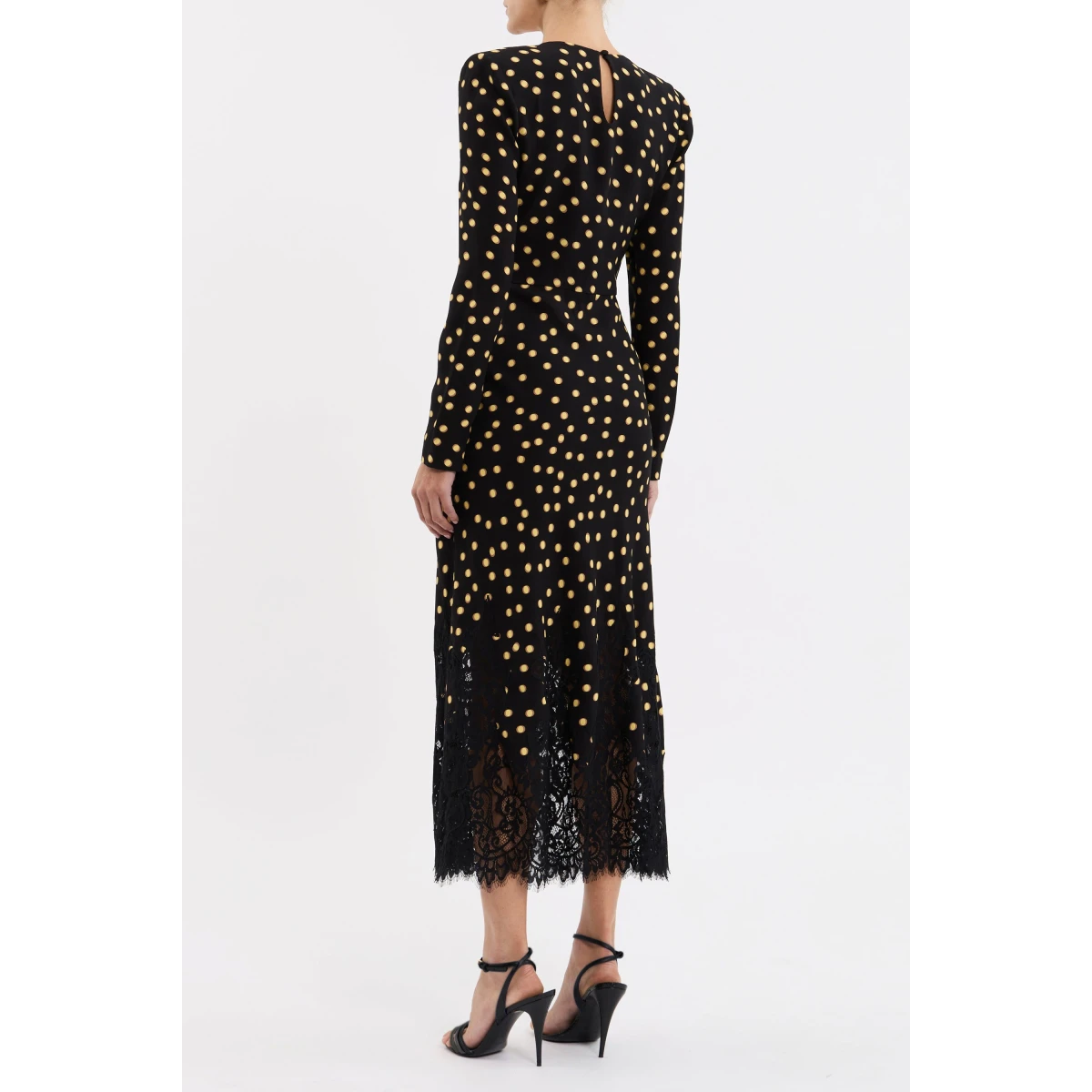 adding a touch of chic style to the design. Long fitted sleeves with invisible zip fastenings offer ease of wear