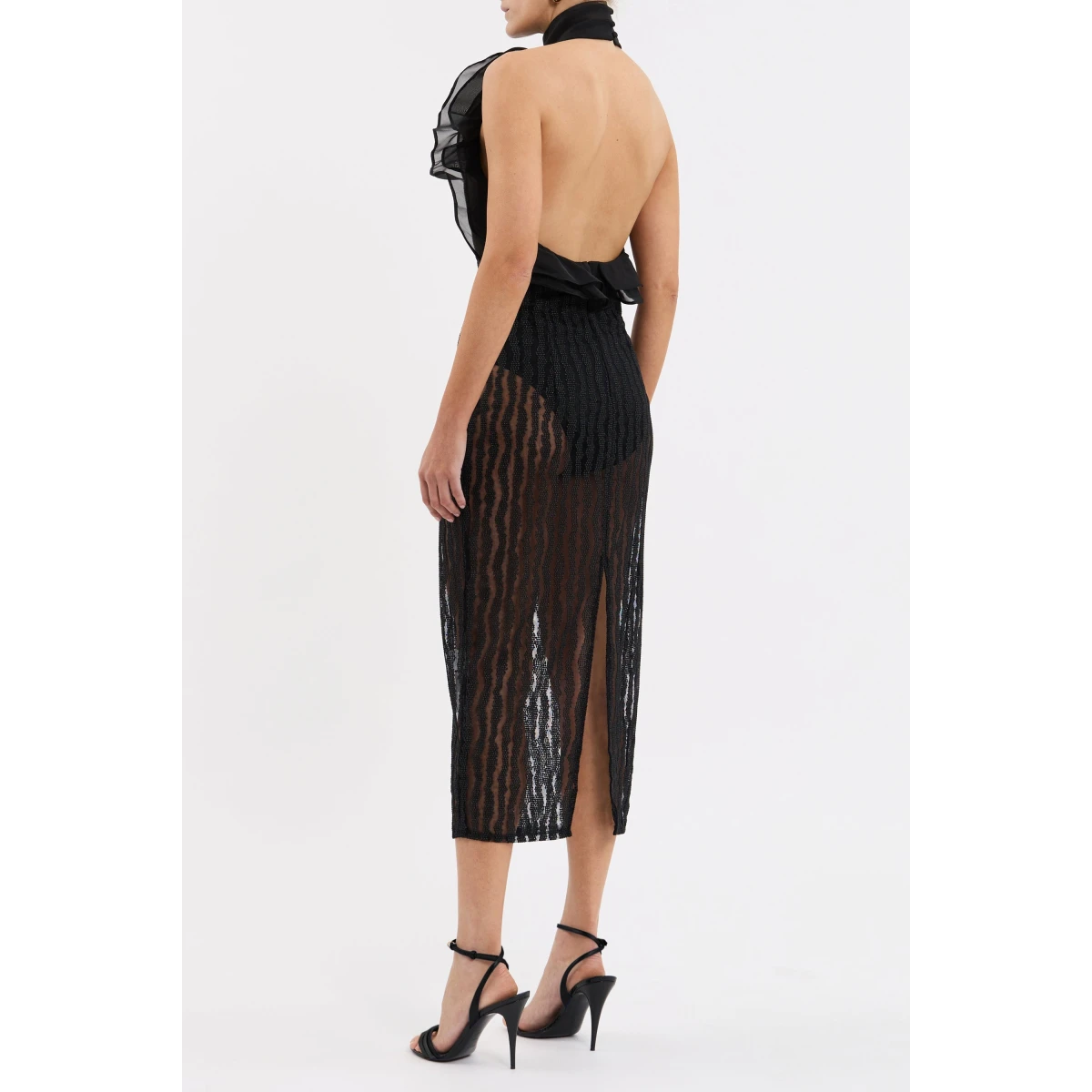 while the fitted midi skirt is finished with a back split for ease of movement. An invisible zip fastening at the back and a raw hem complete the polished look.