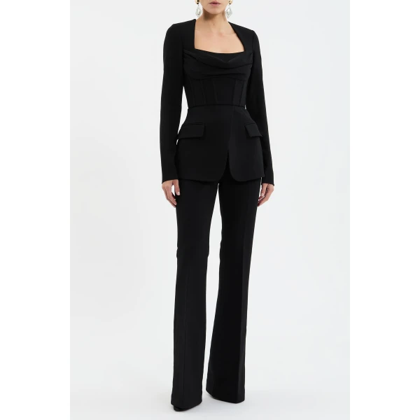 it features long sleeves and a scoop neckline that blend seamlessly into a corseted bodice