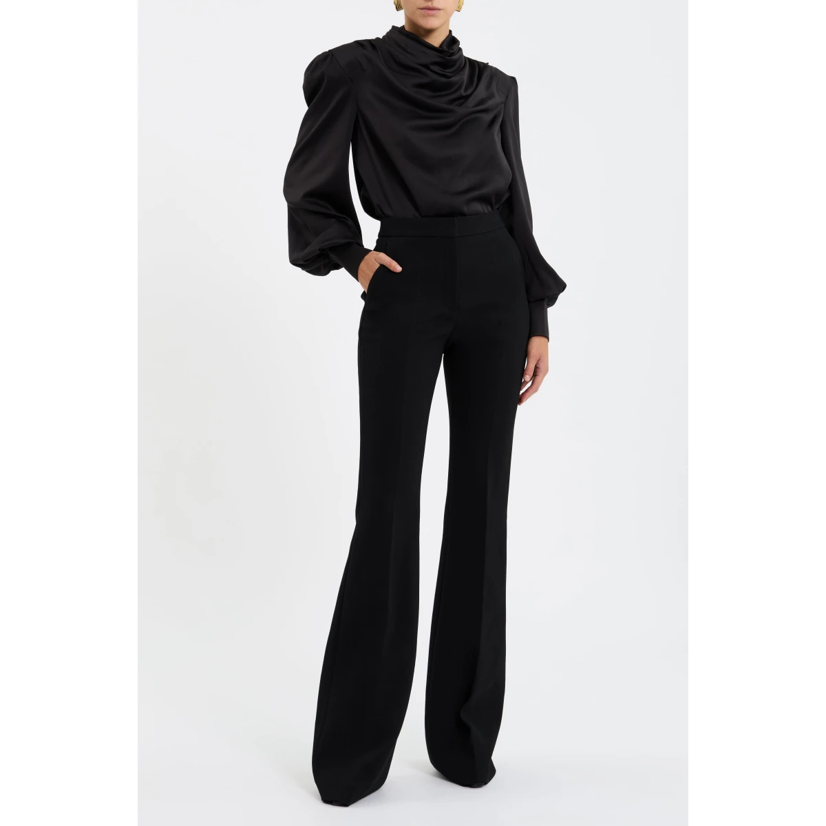 enhanced with shoulder pads for a sophisticated look. Long sleeves with cuffs are refined by back sleeve plackets and button detailing