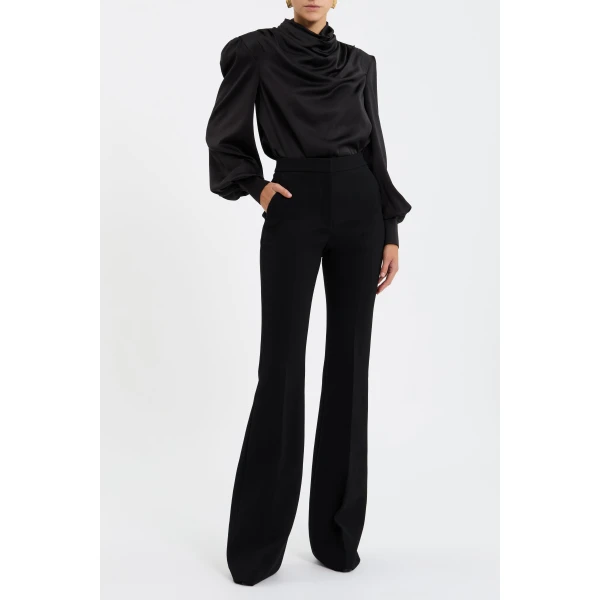 enhanced with shoulder pads for a sophisticated look. Long sleeves with cuffs are refined by back sleeve plackets and button detailing