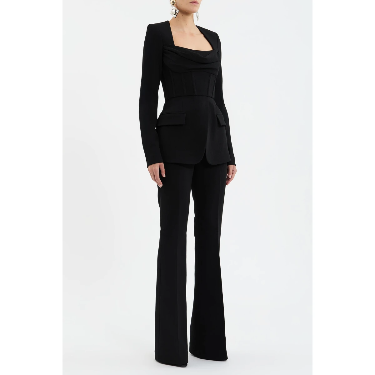 finished with a chic cowl bust for added elegance. Front flap pockets enhance the tailored design