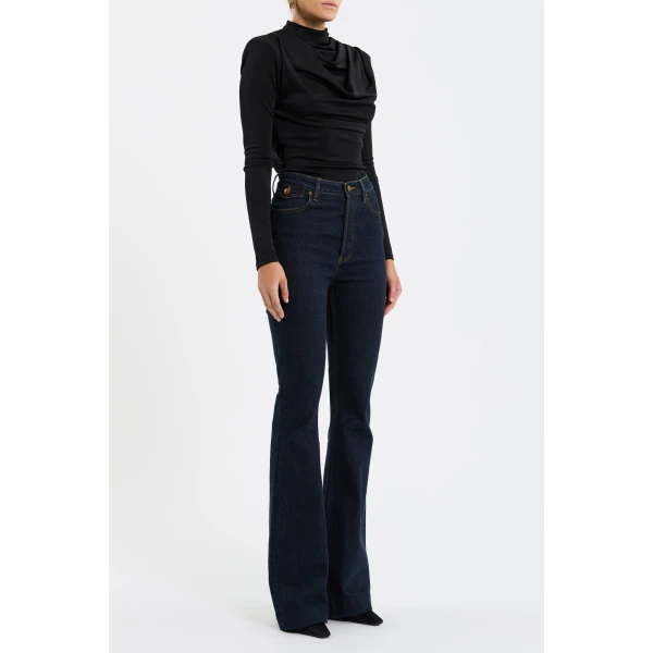 complemented by gathered long sleeves. An open cowl back adds a touch of allure and is secured with buttons at the neck for a polished finish. Versatile and chic