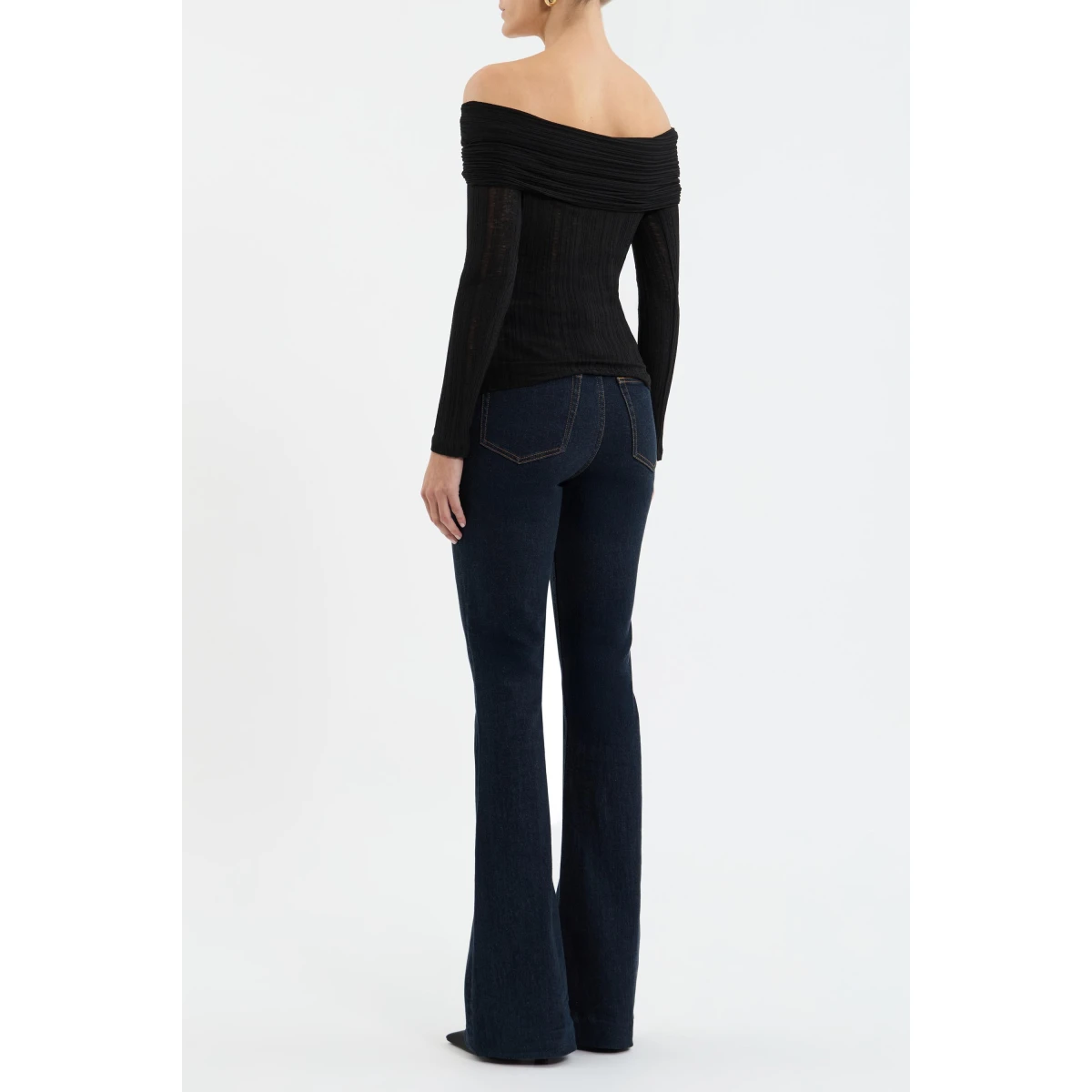 feminine shape. A front cut-out adorned with gold hardware adds a touch of modern allure. Perfect for both day and night