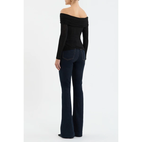 feminine shape. A front cut-out adorned with gold hardware adds a touch of modern allure. Perfect for both day and night