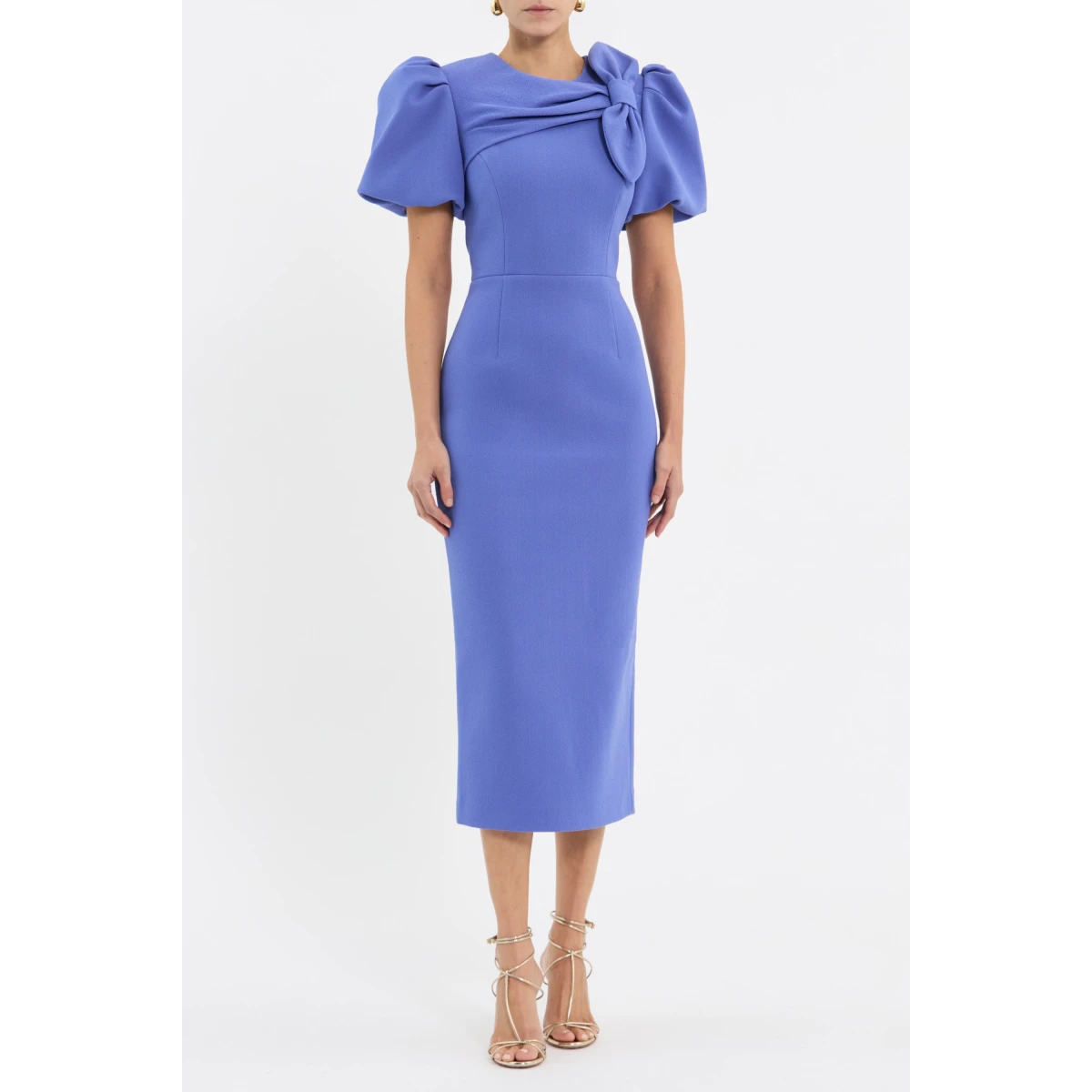 tailored from bonded crepe. It features voluminous short puff sleeves and a rounded neckline