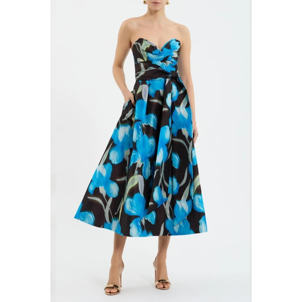 the design is elevated with a draped bustier and a front waist tie for a modern