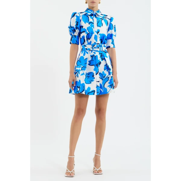 crafted from satin twill in a modern blue floral print. Highlighting a shirt dress silhouette