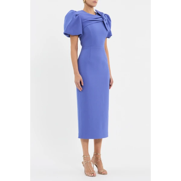 adorned with an asymmetrical draped bow detail for an elegant touch. The pencil midi skirt