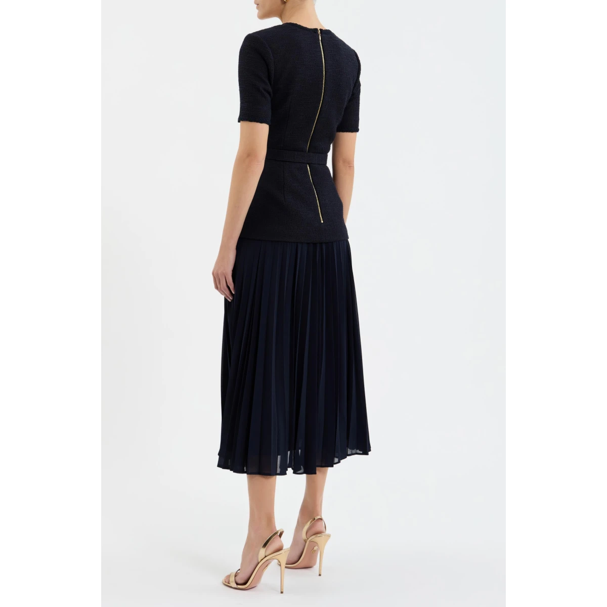 the dress is finished with a zip fastening at the back for a secure fit.