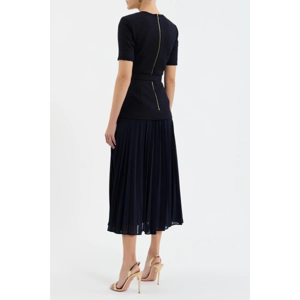 the dress is finished with a zip fastening at the back for a secure fit.