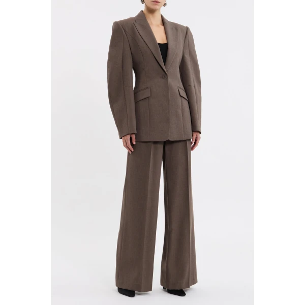 elevated with a cinched waist to flatter the figure. Jet pockets add a practical touch