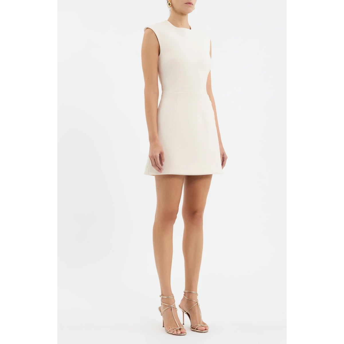 enhanced with princess seams to flatter the figure. Adorned with gold art deco trim details