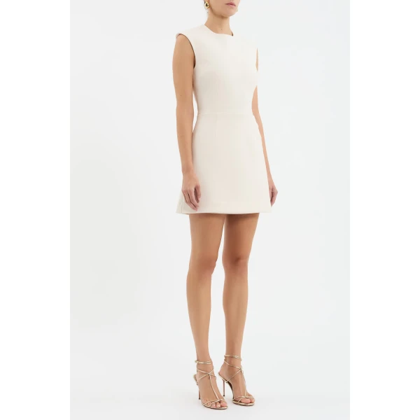 enhanced with princess seams to flatter the figure. Adorned with gold art deco trim details