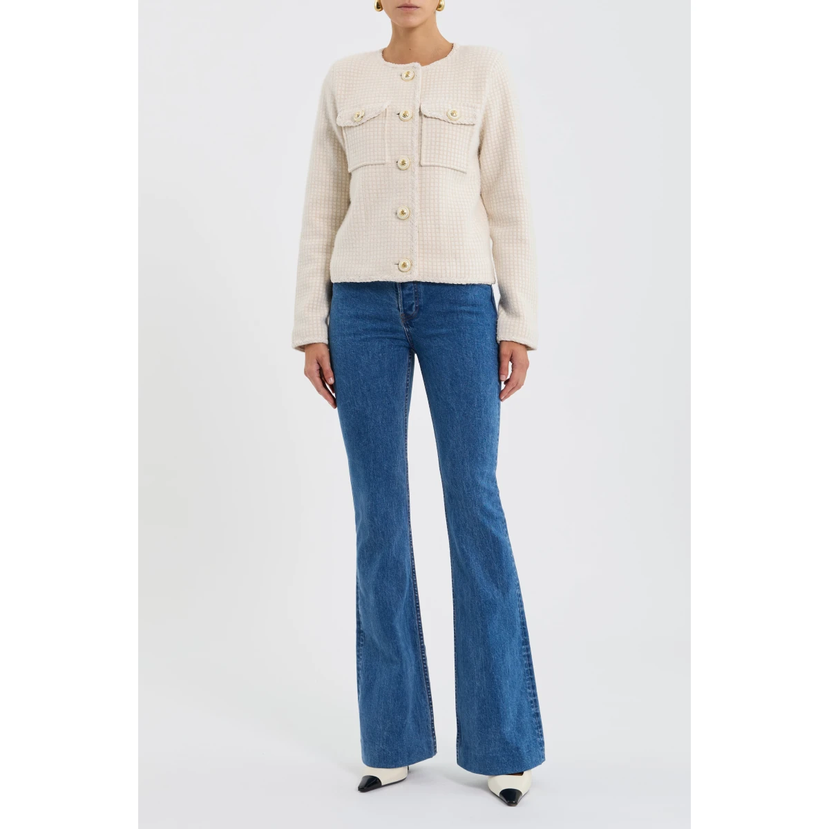 it's detailed with braided trim and gold hardware buttons for a refined finish. Patch pockets add a practical touch