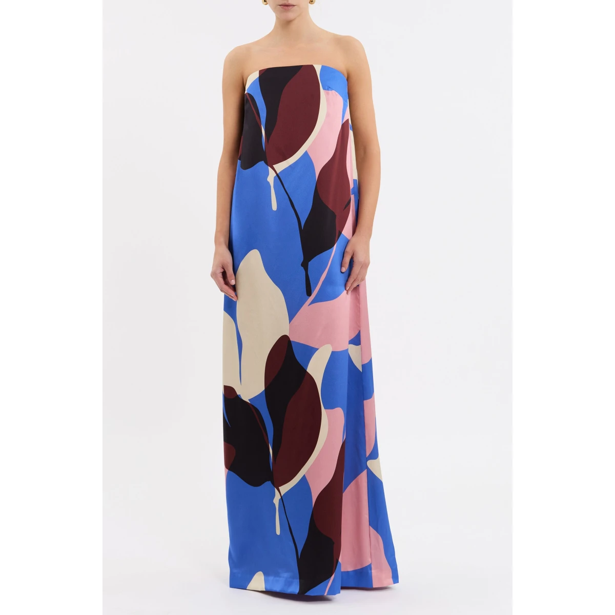 tailored from silk. Highlighting a feminine strapless neckline
