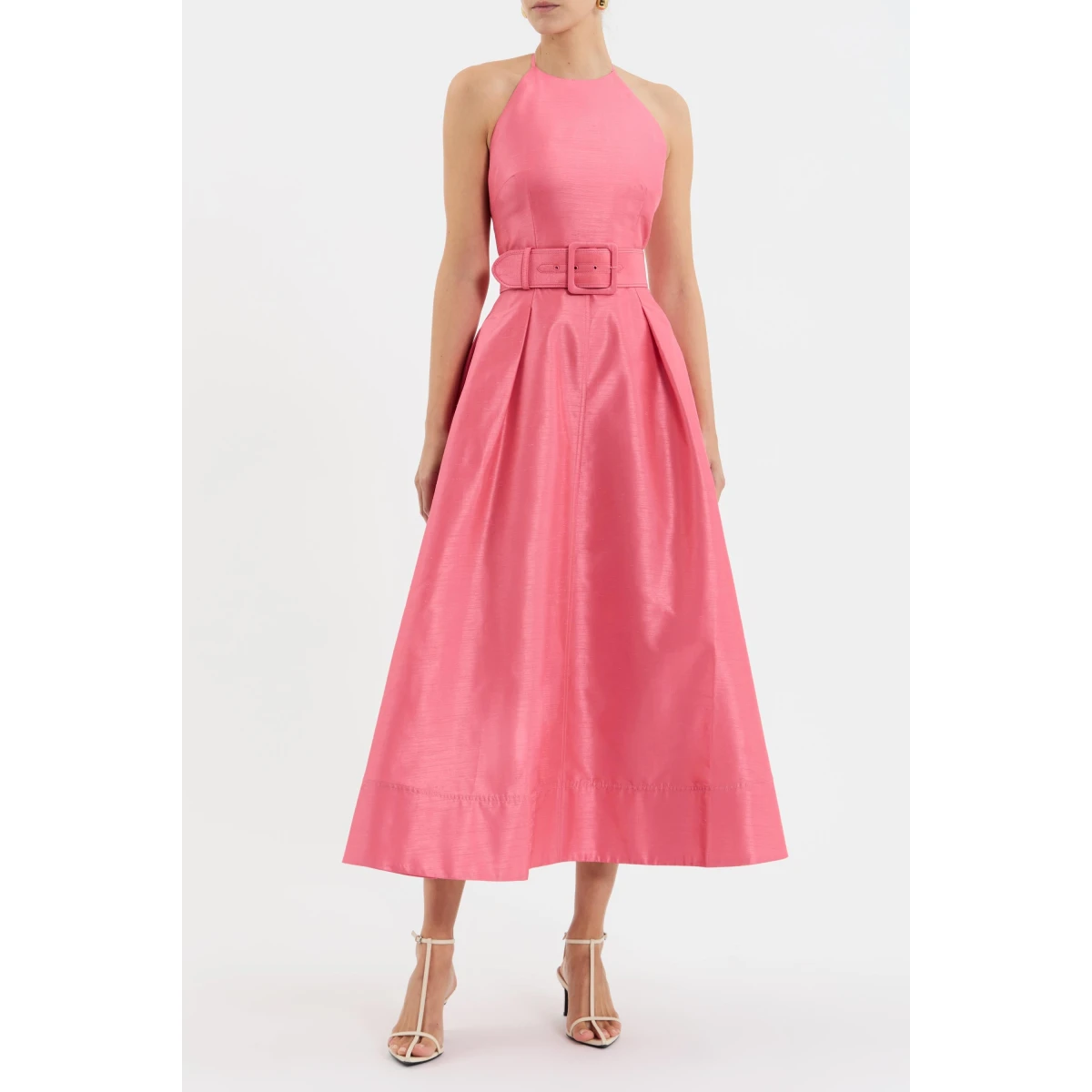 it features a sophisticated halter neckline and fitted bodice