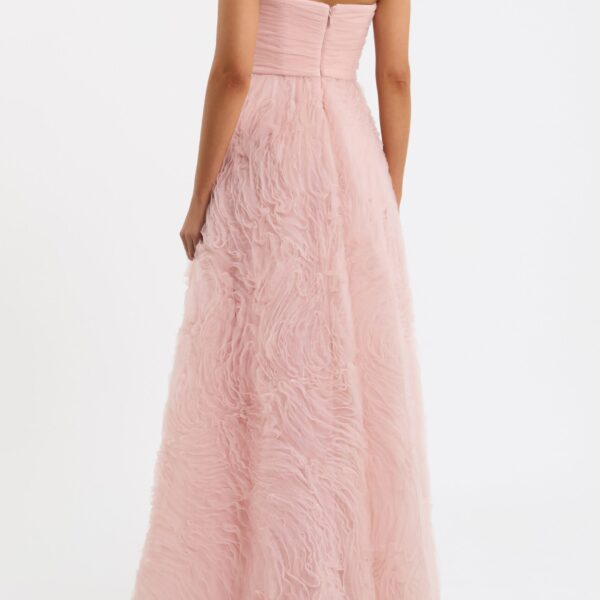the voluminous circular skirt creates an elegant silhouette